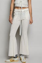 White textured ribbed knit flared pants with drawstring waist and side pockets from POL collection