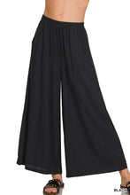 Black zenana woven pleated wide leg pants with soft flowing fabric and elastic waistband in linen blend material