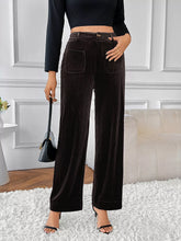 Black high-waisted wide-leg pants made of corduroy with front pockets and a wide-leg fit