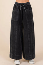 Black mineral wash wide-leg twill pants with drawstring waist and two large front pockets by Mittoshop mineral wash twill pants