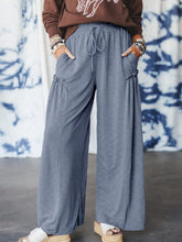Gray casual wide leg drawstring pants with ruched side pockets and a relaxed flowing silhouette for comfort