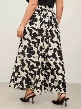 Plus size abstract print wide-leg pants in black and white geometric pattern with a loose comfortable fit