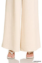 Sand beige wide-leg trousers with textured crinkled fabric featuring zenana woven airflow elastic waistband pants