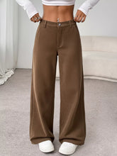 Brown ribbed wide leg casual pants with a button closure featuring a comfortable wide-leg design