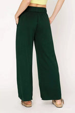 Dark green umgee wide leg pants with elastic drawstring waistband high waist and side pockets for comfortable wear
