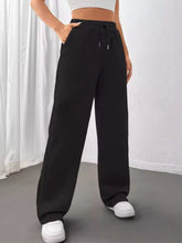 Black relaxed fit drawstring waist wide-leg sweatpants with side pockets for casual comfort and style