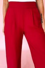 Vibrant red pleated pull on high elastic waist trousers with tailored loose straight design for stylish comfort