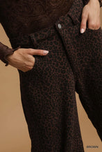 Umgee leopard print wide leg pants in brown textured fabric with button closure and dark leopard print design