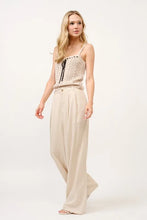 Beige high-rise wide leg linen blended pants with button closure and comfortable wide leg linen fit