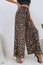 Beige and black leopard high waist wide leg pants with elastic waistband made from lightweight fabric