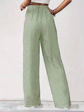 High-waisted striped wide leg pants in green and white vertical stripe pattern for stylish casual wear