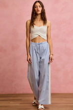 Light blue and white wide check pants with side lace trim and piping featuring wide-leg and vertical side stripes