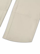Beige cotton plus size relaxed fit casual pants with clean straight seams and neatly finished hems