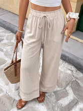 Beige linen casual drawstring wide leg pants with elastic waistband and subtle lace trim along the hem