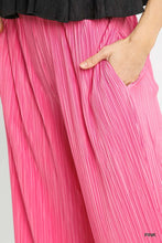 Umgee wide leg pants in vibrant pink with pleated soft flowing fabric and subtle vertical ridges