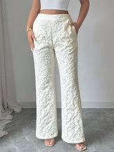 White lace patterned textured high waist wide leg trousers with flared hem for elegant styling