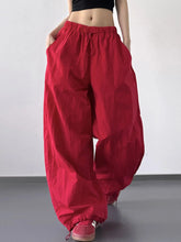 Red drawstring wide leg pants with elastic waistband and loose fit for comfortable casual wear