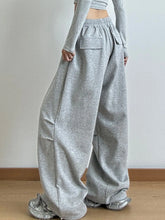 Gray heathered drawstring wide leg pants with relaxed fit and elastic waistband featuring easy care instructions
