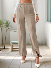 Beige corduroy high-waisted slit pants featuring wide-leg design elastic waistband and side slit detailing