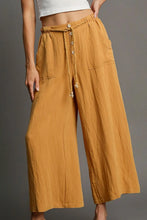 Umgee full size wide-leg pants in mustard-yellow linen with rope drawstring and button closures care instructions included