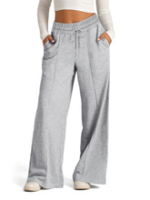 Gray heathered wide leg drawstring pants with elastic waistband made from soft sweatpant material for comfortable wear