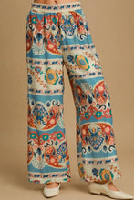 Umgee full size wide leg border print pants in teal coral orange and cream paisley floral print on lightweight fabric