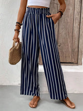 Full size striped high waist wide-leg pants in navy blue and white with elastic waistband and tape measure detail