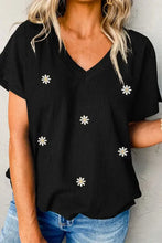 Black short sleeve V-neck T-shirt with white daisy embroidery