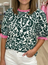Women’s half sleeve blouse with bold green and white damask print and pink ruffled color block trim at neckline and cuffs