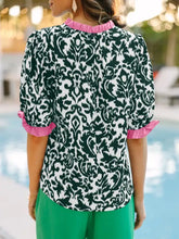 Black and white damask half sleeve blouse with pink ruffled color block trim at the neckline