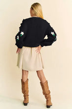 Dani floral pattern embroidered black hoodie jacket with ruffled sleeves and beige skirt