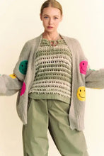 Dani fuzzy smile long sleeve cardigan with gray smiley face, colorful patches