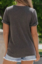 Dark gray ribbed short sleeve V-neck top with chest pocket