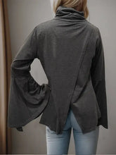 Dark grey long sleeve mock neck top with bell sleeves and open back
