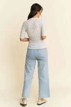 Davi Dani lace floral top with light blue embroidered wide-leg jeans and white sneakers