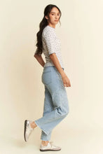 Davi Dani lace floral top with floral marrow edge over light blue embroidered jeans and silver sneakers