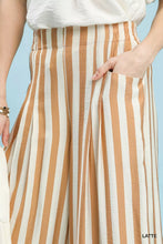 Umgee wide leg pants with a tan and cream vertical stripe pattern in lightweight fabric with an elastic waistband