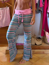 Striped pants with wide legs featuring a pink elastic waistband and matching drawstring in drawstring striped style