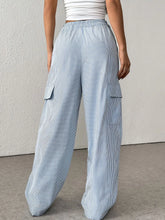 Light blue and white drawstring striped wide leg cargo pants with elastic waistband and vertical stripes