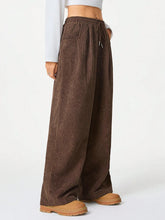 Brown corduroy wide leg drawstring pants with elastic waistband for comfortable casual wear