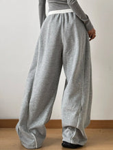 Gray heathered drawstring wide leg pants with white elastic waistband and matching side seam stitching
