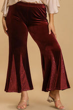 Deep burgundy velvet flare leg pants with size sequin elastic side panels and an elastic waistband by umgee plus size