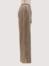 Beige textured knit wide leg pants with a drawstring waistband for comfortable casual wear