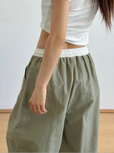 Olive green wide leg drawstring casual pants with white elastic waistband for comfortable everyday wear