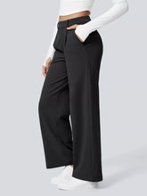 Black wide-leg pants with a sleek tailored fit and belt loop designed for machine wash cold care
