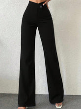 Black high waist wide leg pants with button closure offering perfect fit and easy care instructions including machine wash