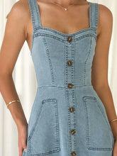 Light blue denim a-line dress with brown buttons and front pockets in decor button front a-line denim dress style