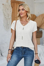 Women’s white decorative button eyelet short sleeve V-neck top