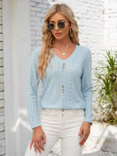 Light blue eyelet knit V-neck T-shirt with long sleeve length and decorative button openwork