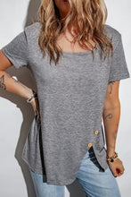 Woman in decorative button scoop neck short sleeve t-shirt